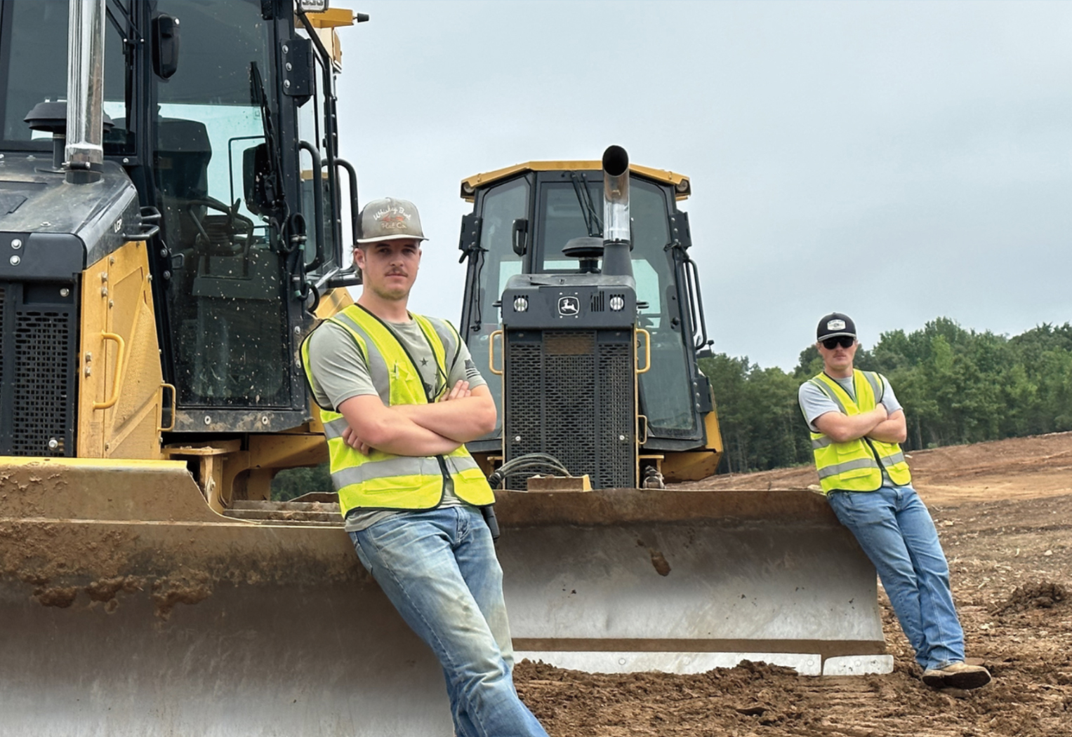 HEO Academy students with heavy equipment on the training grounds